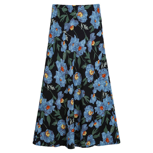 Woman wearing Floral Printed Fishtail Skirt in a sunny garden