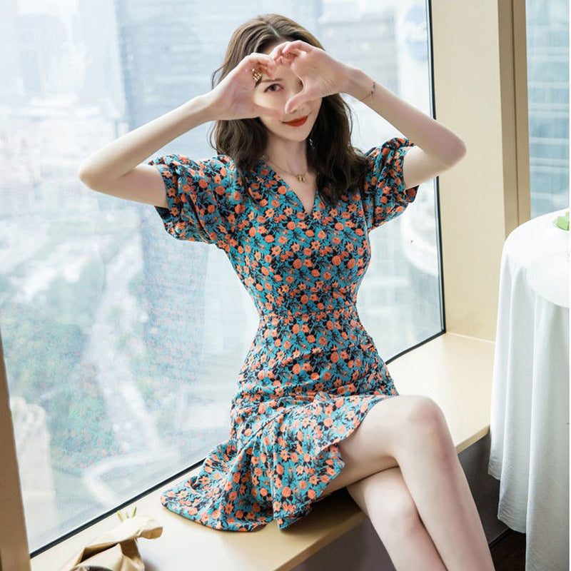 Woman wearing Floral Print A-Line Dress in a garden setting