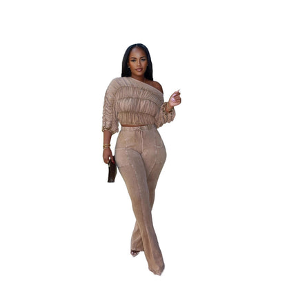 Woman wearing Flattering Two Piece Set with Crop Top and Flared Pants in a stylish urban setting