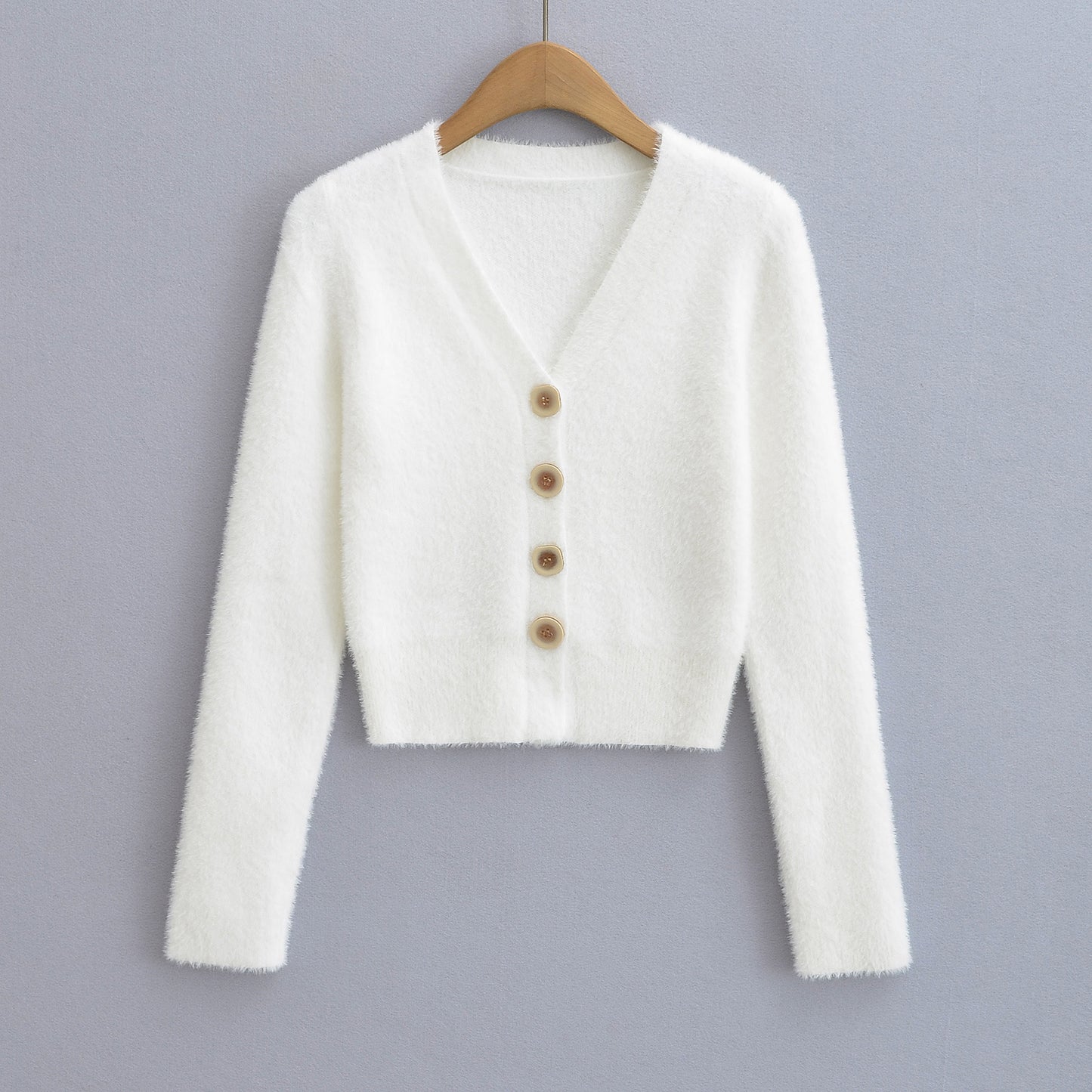 Woman wearing V-Neck Long Sleeve Cardigan Sweater in a chic office setting