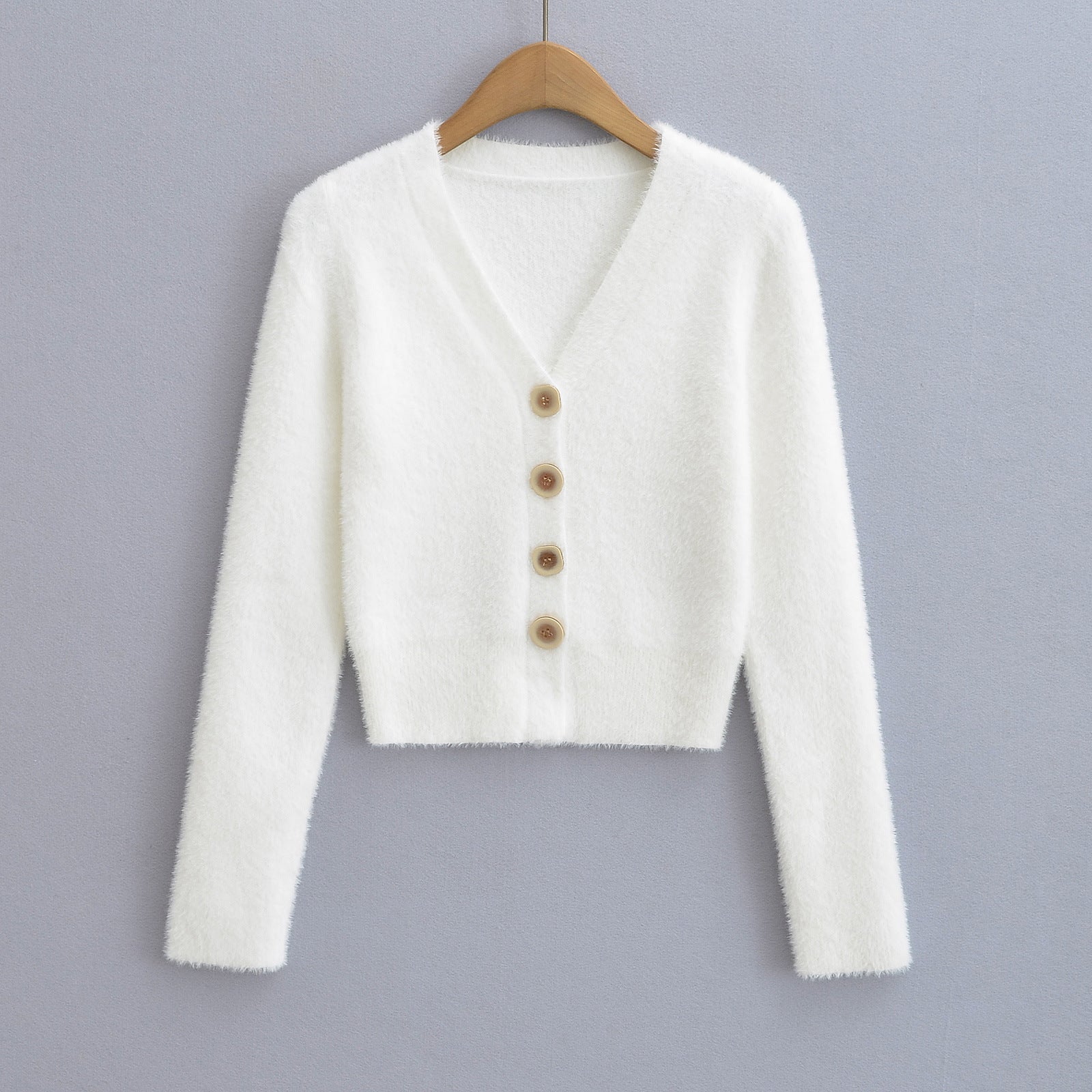 Woman wearing V-Neck Long Sleeve Cardigan Sweater in a chic office setting