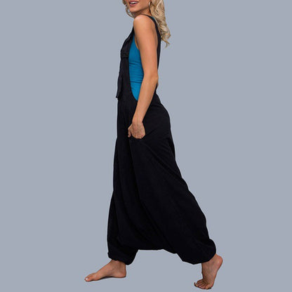 Woman wearing Wide Leg Harem Jumpsuit with Pockets in a sunny outdoor setting