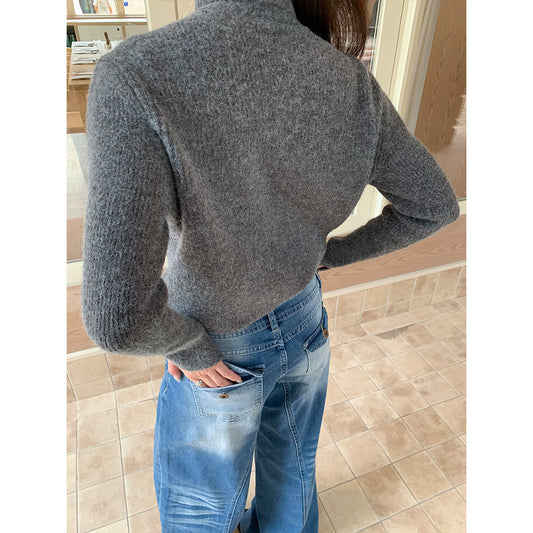 Woman wearing Wide Leg Flare Jeans in a casual outdoor setting