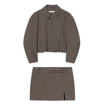 Woman wearing Houndstooth Jacket and Waistband Skirt Pants Set in a stylish urban setting