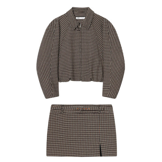 Woman wearing Houndstooth Jacket and Waistband Skirt Pants Set in a stylish urban setting