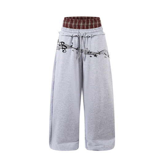 Woman wearing Double Waistband Music Note Graffiti Wide Leg Pants in a casual setting
