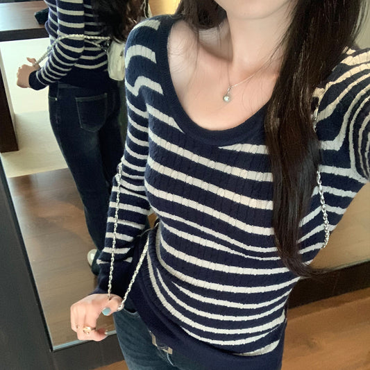 Woman wearing U-Neck Stripe Slim Fit Knit Top in a casual setting