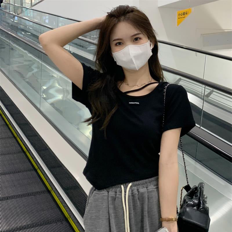 Woman wearing Irregular Design Short Sleeve Crop Top in casual setting