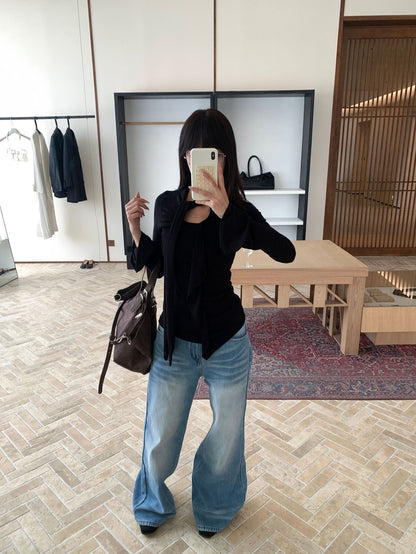 Woman wearing fleece lined wide leg jeans in a casual street setting