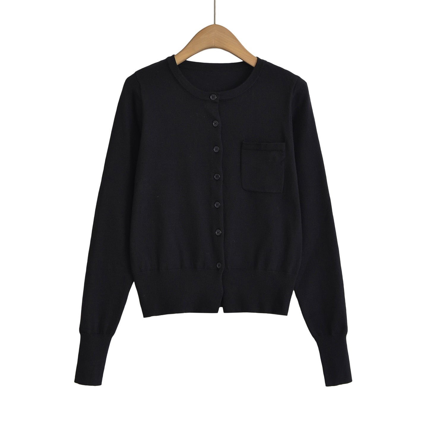 Woman wearing Round Neck Long Sleeve Shirt with Pocket in a casual setting