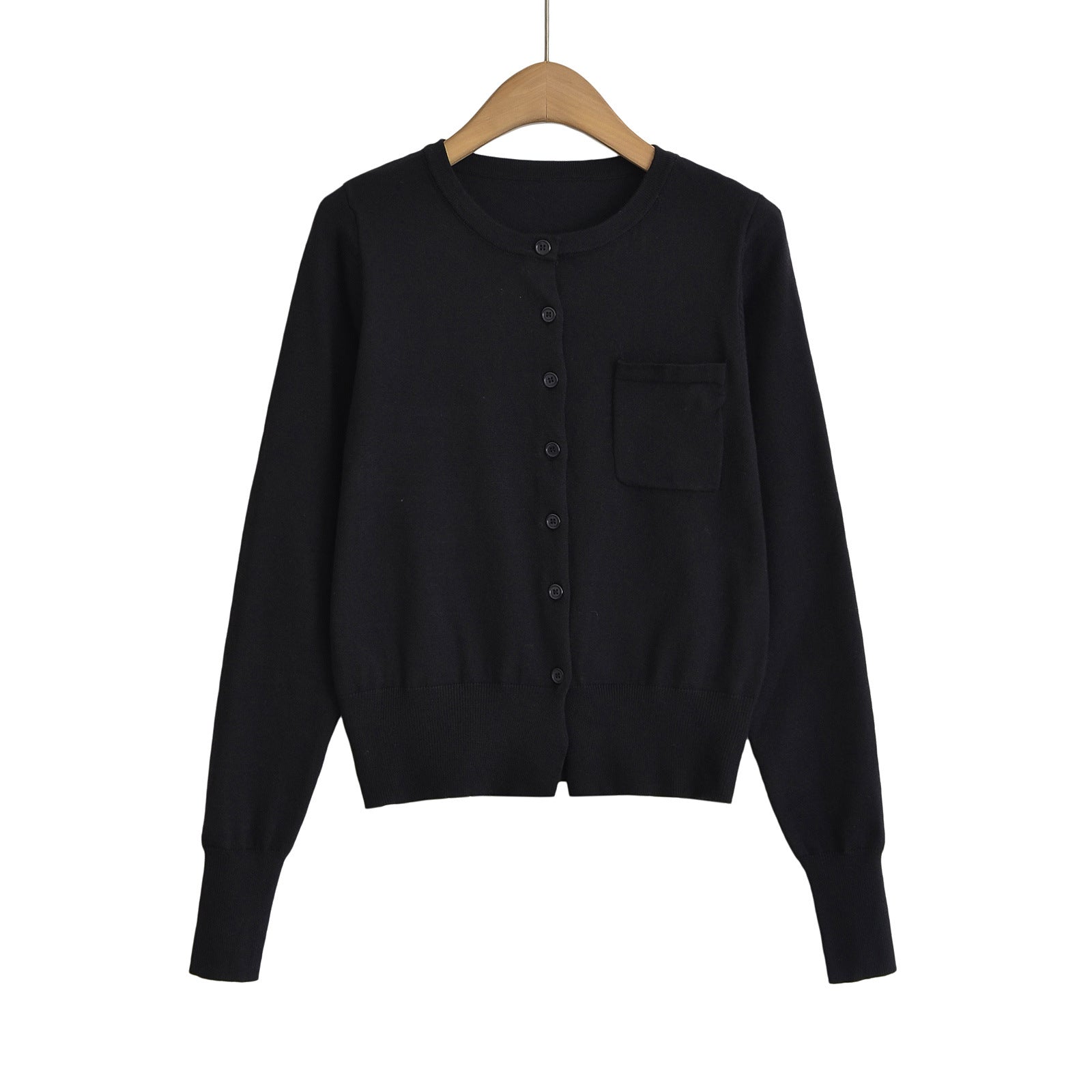 Woman wearing Round Neck Long Sleeve Shirt with Pocket in a casual setting