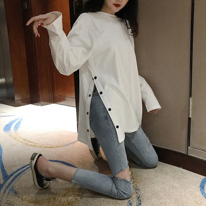 Woman wearing Plus Size Long Sleeve Midi Top in a casual setting