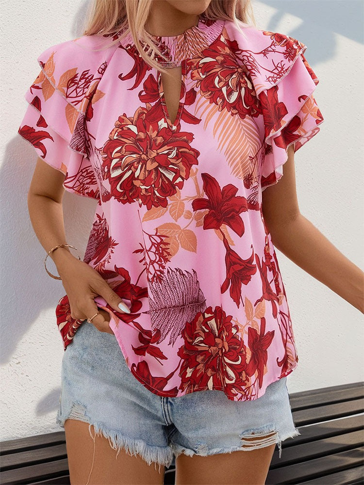 Woman wearing Lotus Leaf Layered Sleeve Printed Shirt in a sunny outdoor setting