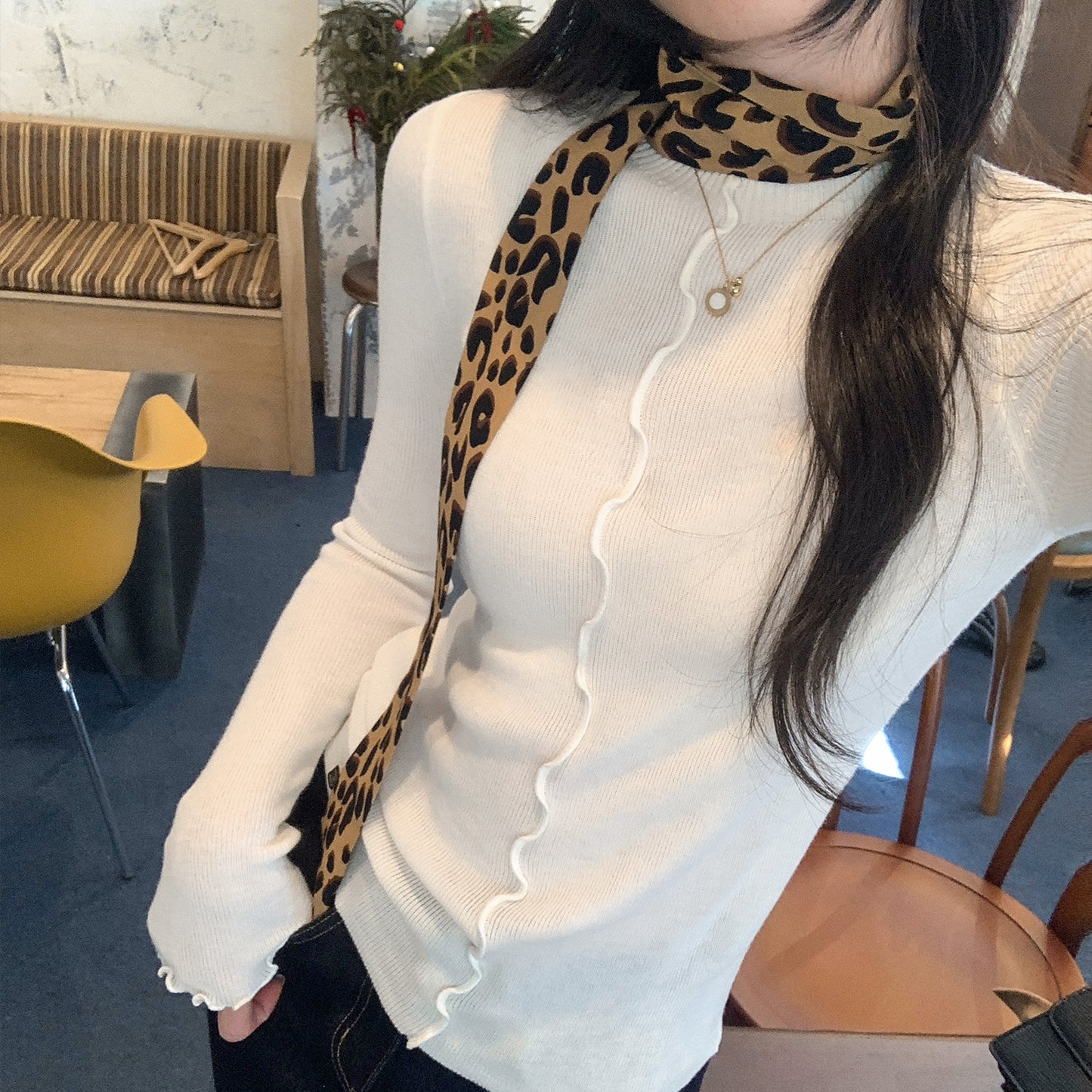 Woman wearing Lace Trim Round Neck Long Sleeve Knit Top in a stylish setting