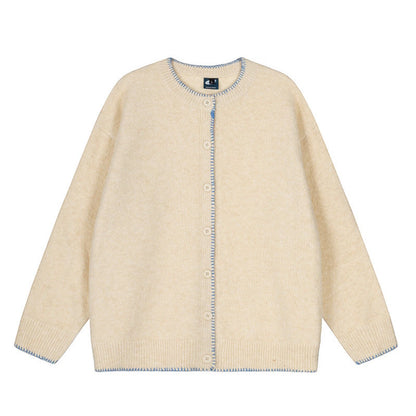 Woman wearing Hand-Stitched Loose Fit Knit Cardigan in a cozy setting
