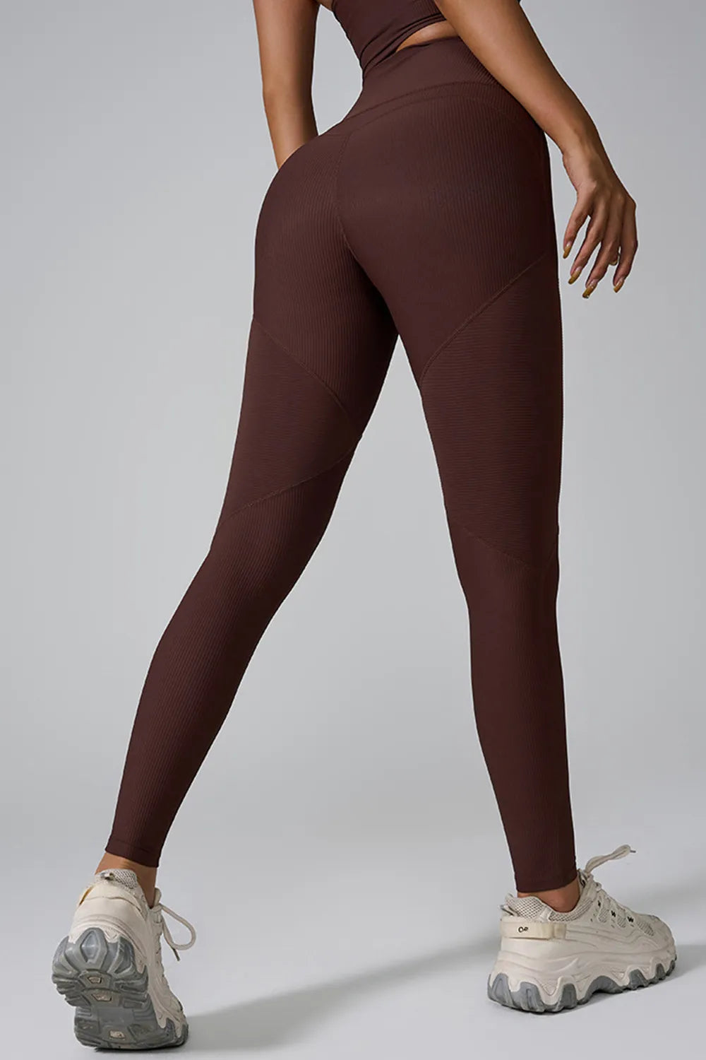 Woman wearing High Waist Active Leggings in a gym setting