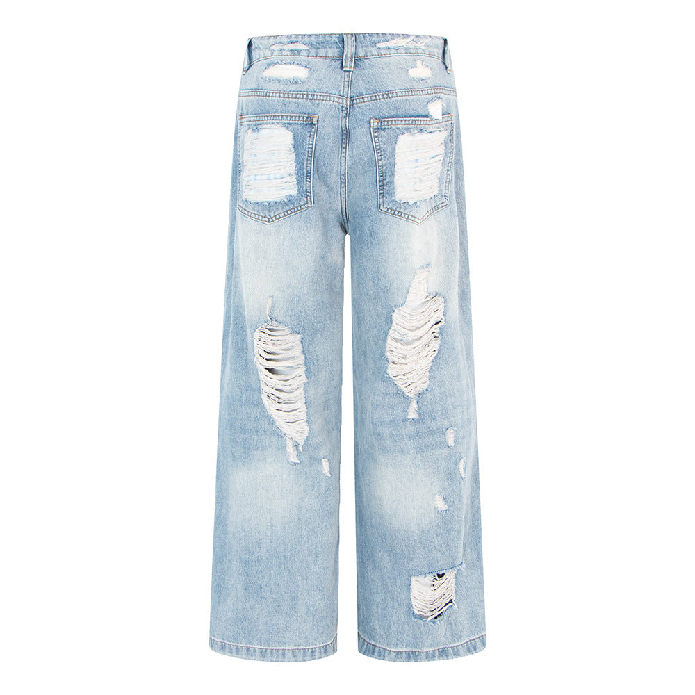 Woman wearing Vintage Distressed Wide Leg Jeans in an urban setting