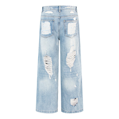 Woman wearing Vintage Distressed Wide Leg Jeans in an urban setting