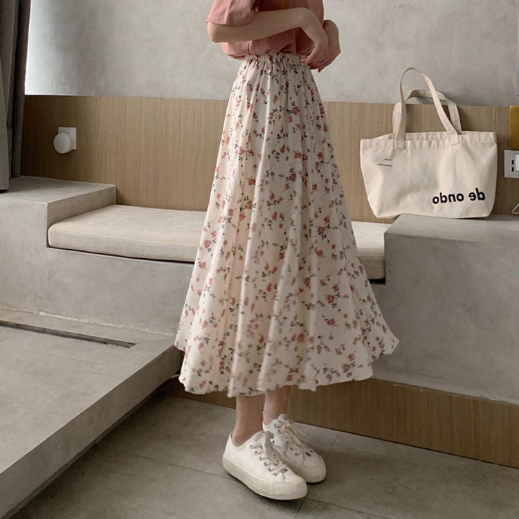 Woman wearing Floral Bohemian A-Line Midi Skirt in a sunny park