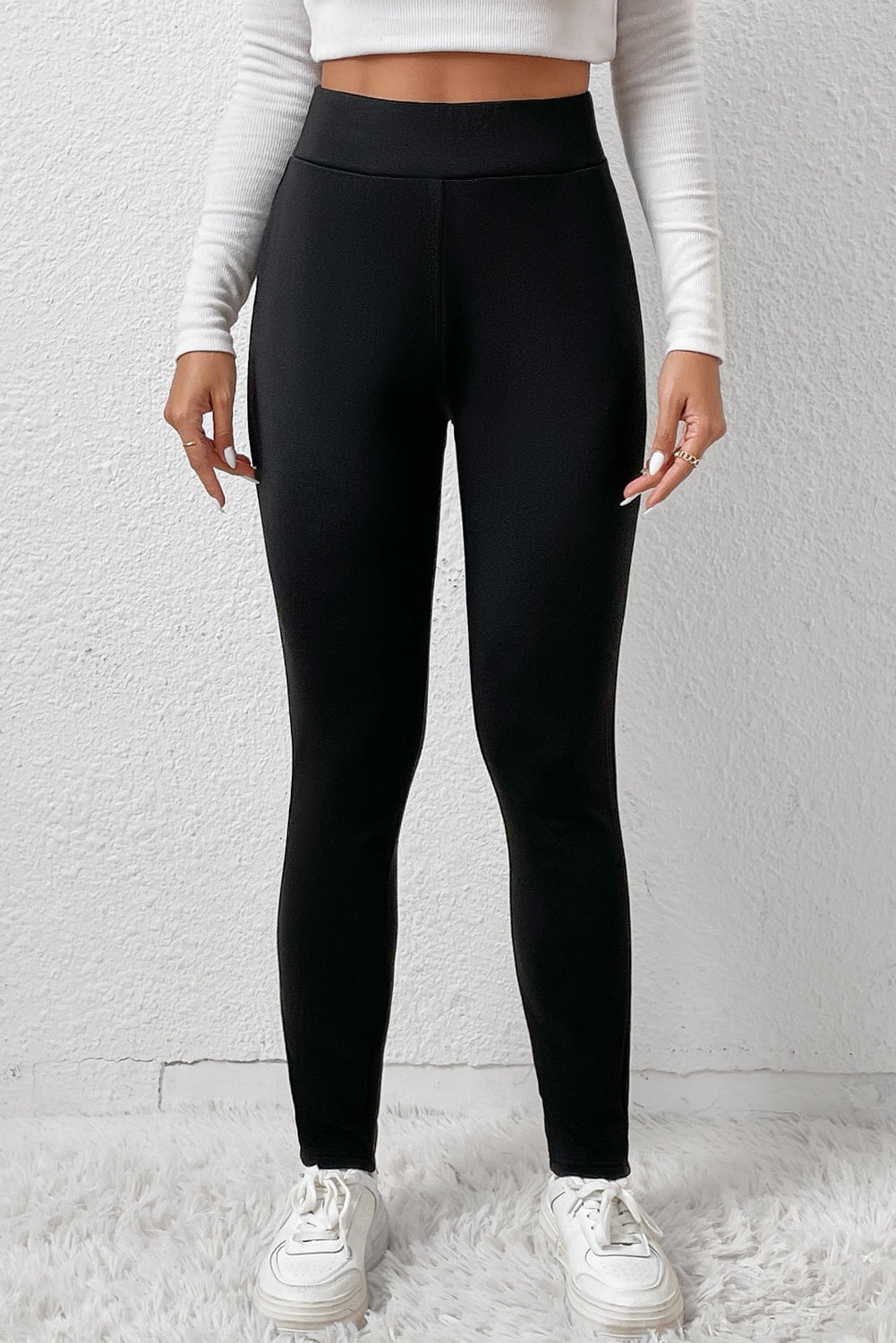 Woman wearing High Waist Fleece Lined Winter Leggings in a cozy winter setting