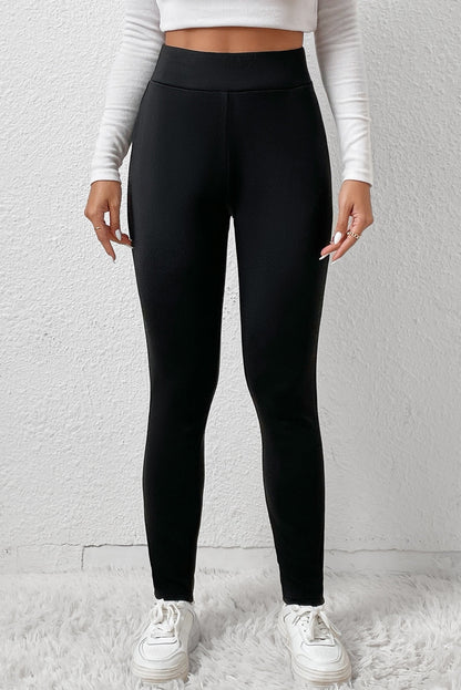Woman wearing High Waist Fleece Lined Winter Leggings in a cozy winter setting