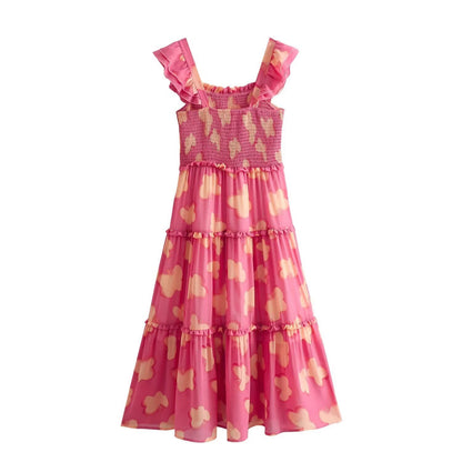 Woman wearing Floral Resort Style Square Neck Strap Dress in a sunny beach setting