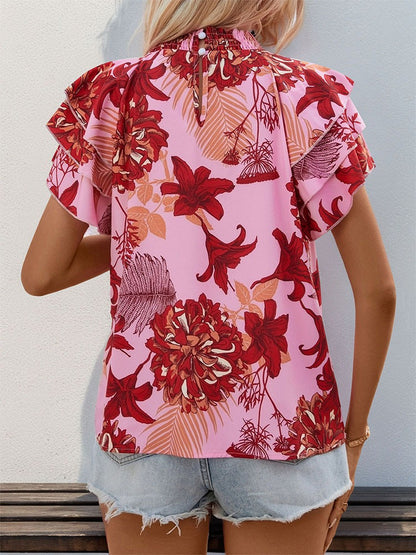 Woman wearing Lotus Leaf Layered Sleeve Printed Shirt in a sunny outdoor setting