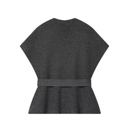 Woman wearing Belted Knitted Vest and Half Skirt Set in a stylish urban setting