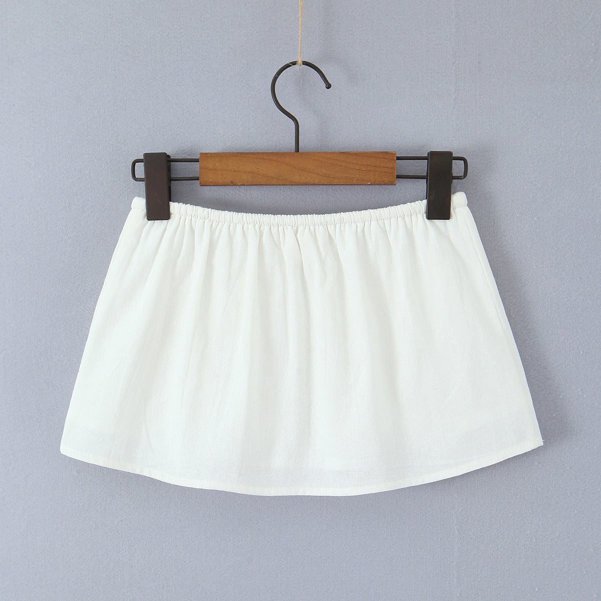 Woman wearing One Shoulder Tie Up Top and Pocket Detailed Skirt Set in a sunny outdoor setting