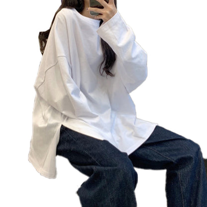 Woman wearing Split Color Long Sleeve T Shirt in a casual setting