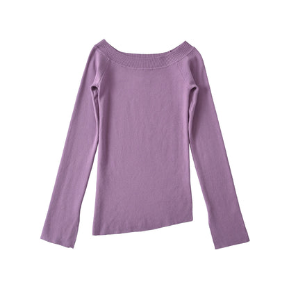 Woman wearing One Shoulder Slit Slanted Hem Top in a stylish setting