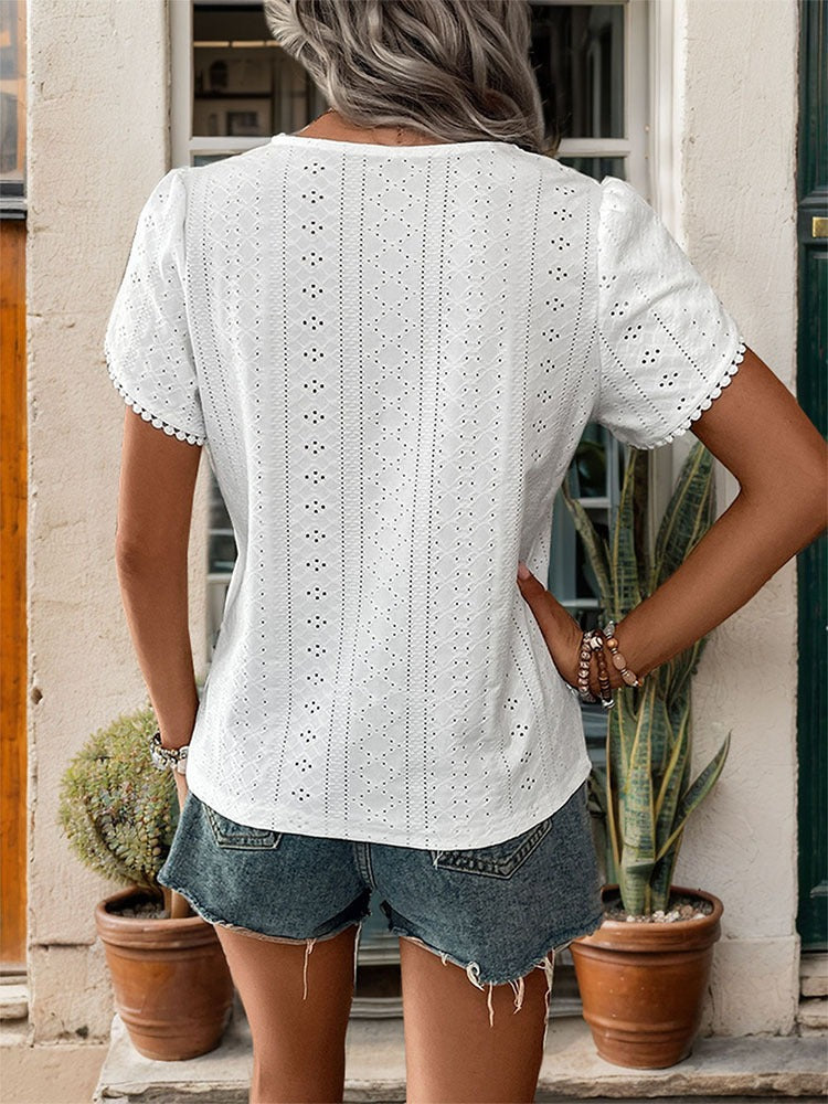 Woman wearing Textured V Neck Shirt in a sunny outdoor setting