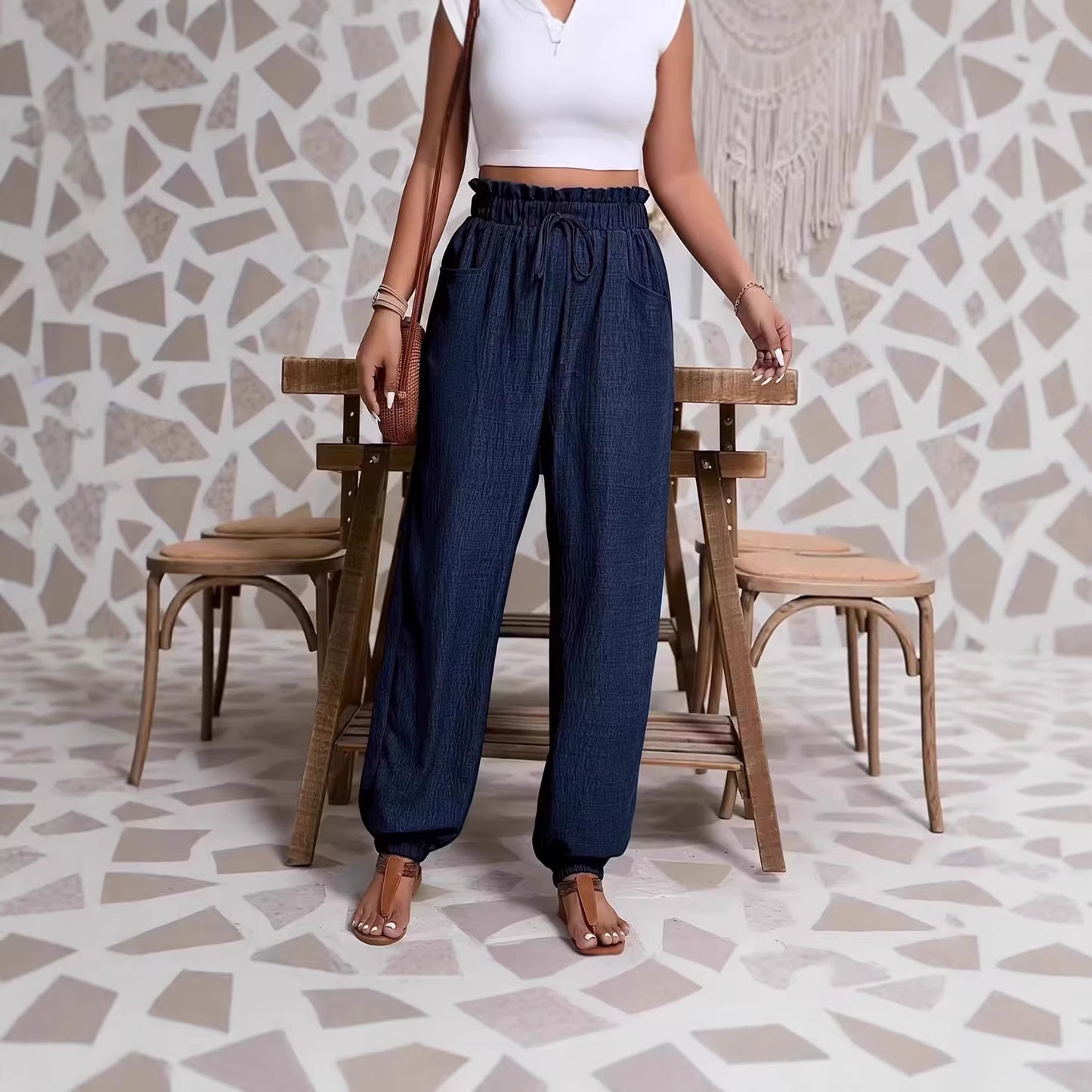 Woman wearing Elastic Solid Color Pants in a casual setting