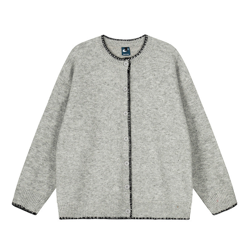 Woman wearing Hand-Stitched Loose Fit Knit Cardigan in a cozy setting