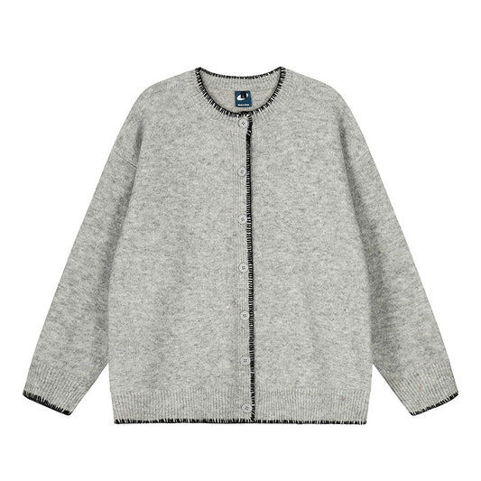 Woman wearing Hand-Stitched Loose Fit Knit Cardigan in a cozy setting