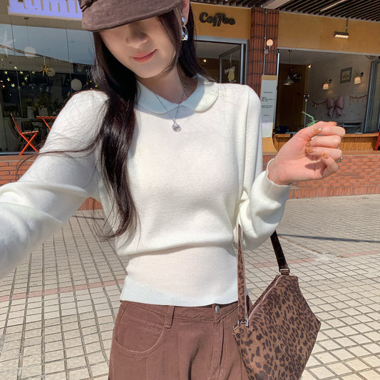 Woman wearing Peter Pan Collar Waist-Cinching Bodysuit in a stylish setting