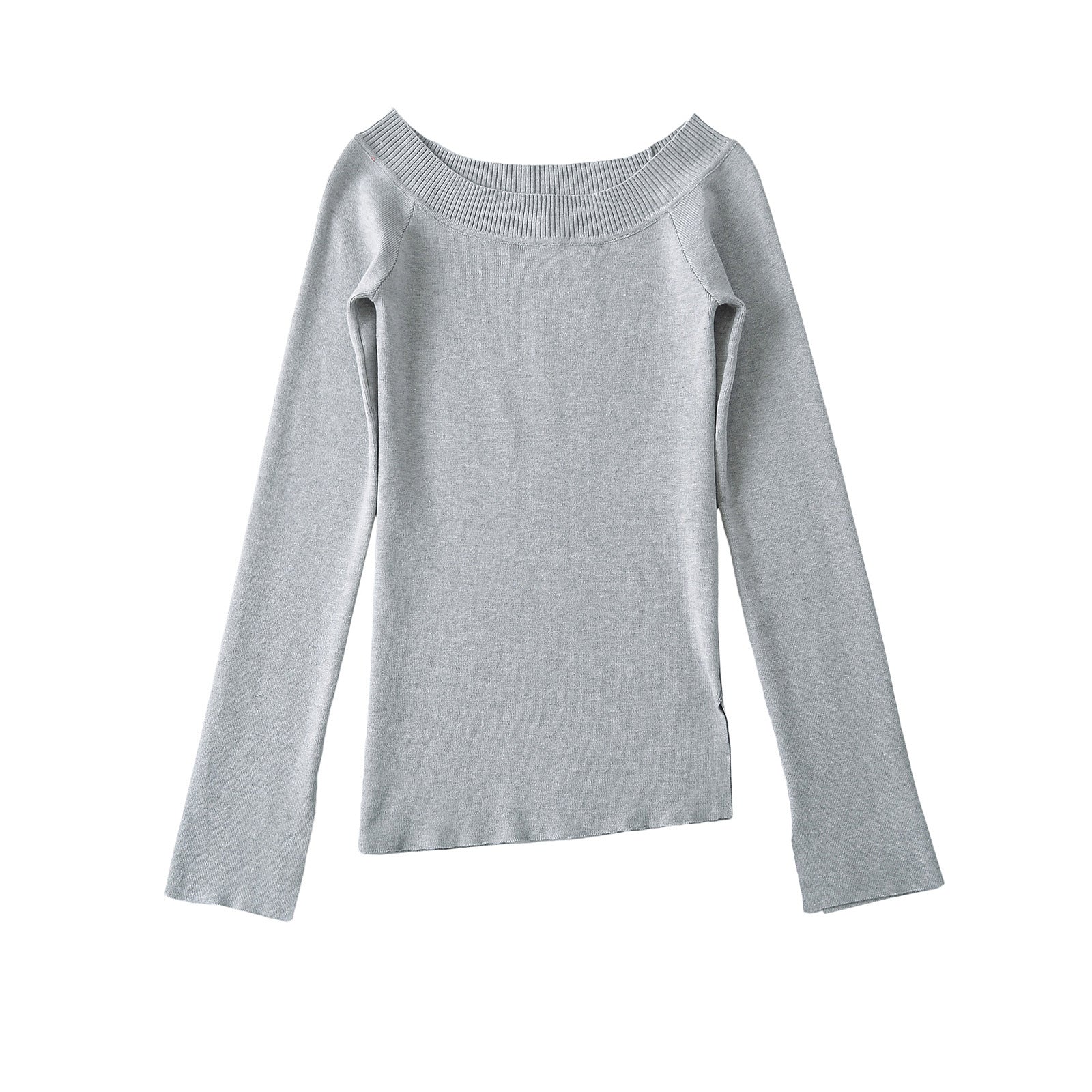 Woman wearing One Shoulder Slit Slanted Hem Top in a stylish setting