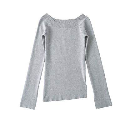 Woman wearing One Shoulder Slit Slanted Hem Top in a stylish setting