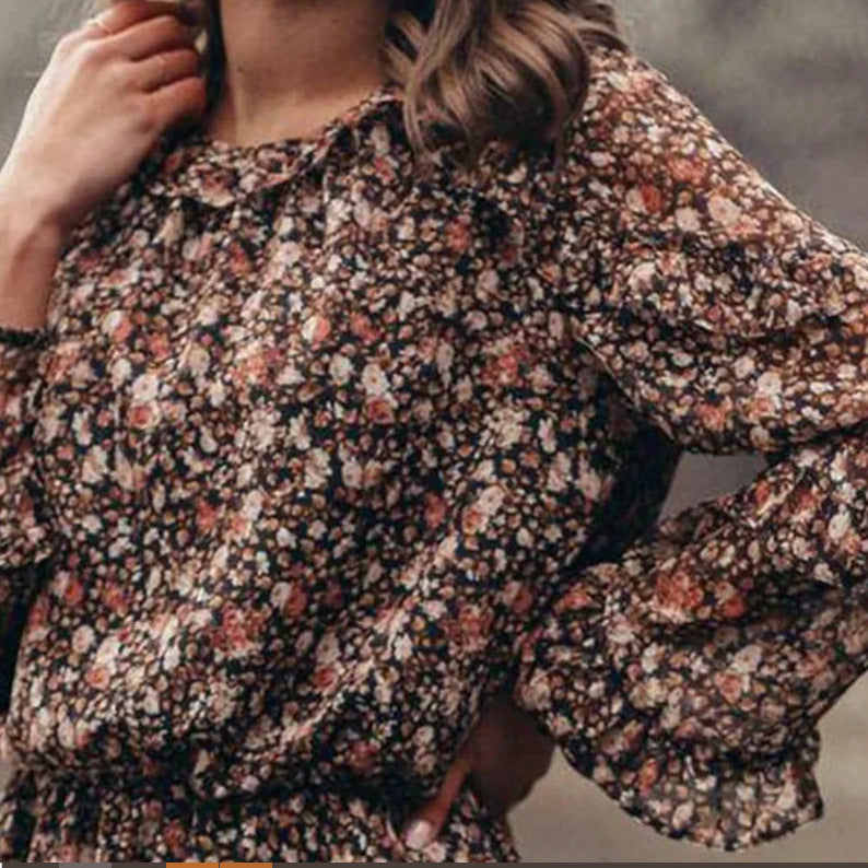 Woman wearing Floral Print Ruffle Sleeve Midi Dress in a garden setting