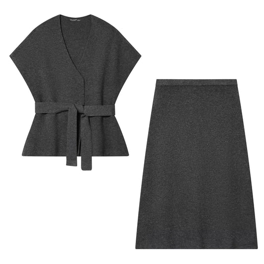 Woman wearing Belted Knitted Vest and Half Skirt Set in a stylish urban setting
