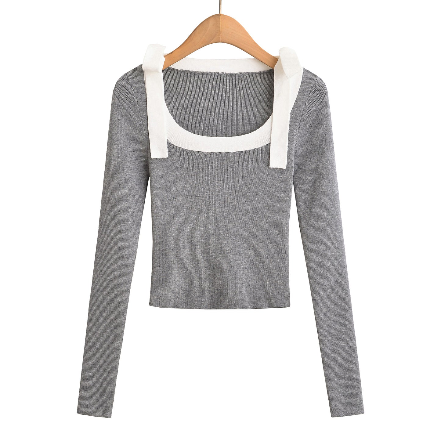 Woman wearing Square Neck Bow Ribbon Slim Fit Long Sleeve Sweater in a chic urban setting