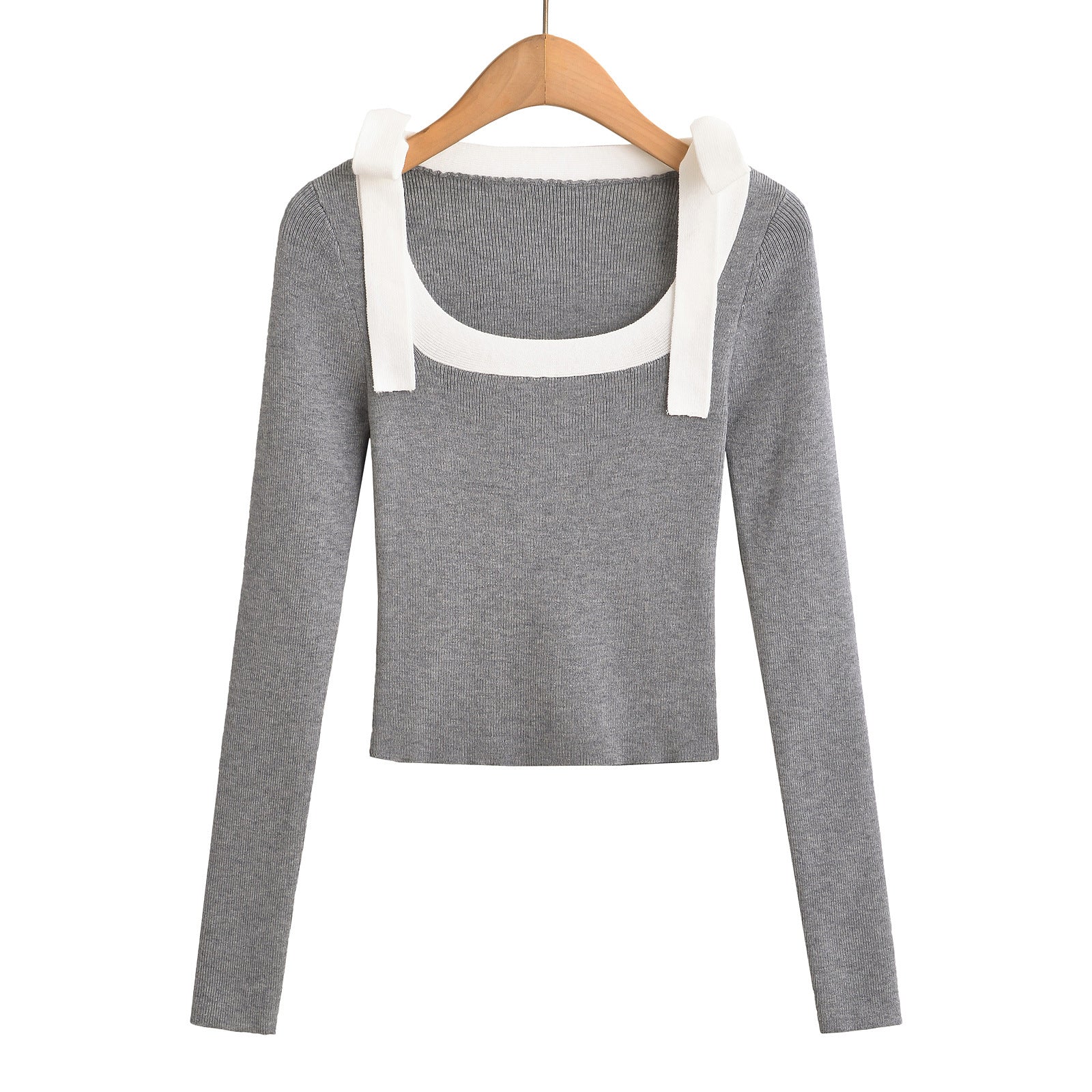 Woman wearing Square Neck Bow Ribbon Slim Fit Long Sleeve Sweater in a chic urban setting