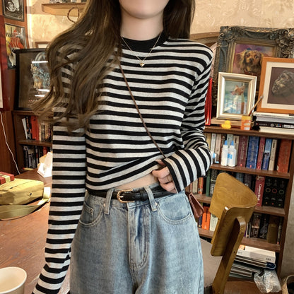Woman wearing Stripe Long Sleeve Crop Top in a casual setting