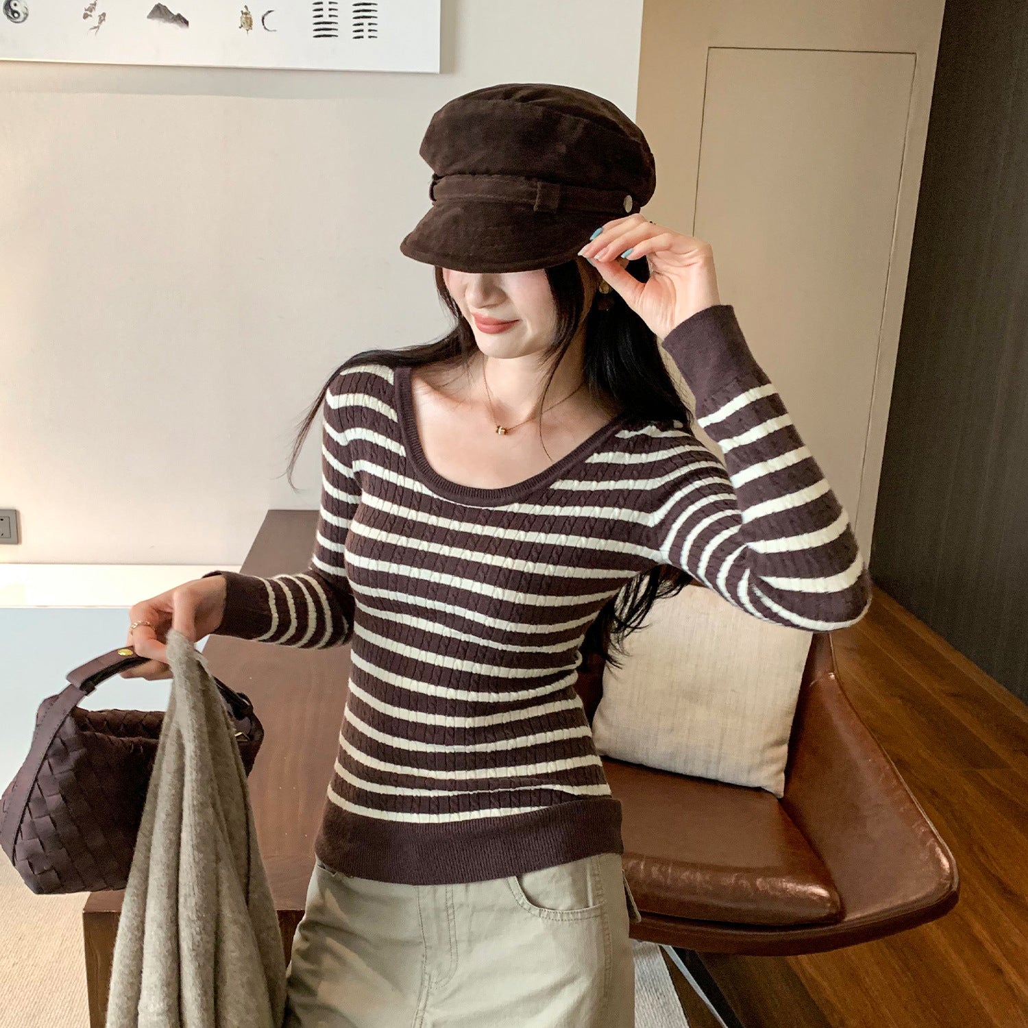 Woman wearing U-Neck Stripe Slim Fit Knit Top in a casual setting