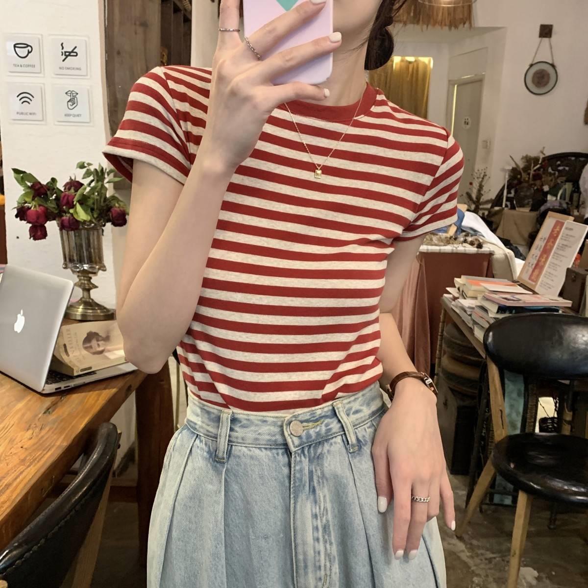 Woman wearing Striped Slim Fit T-Shirt in a casual setting