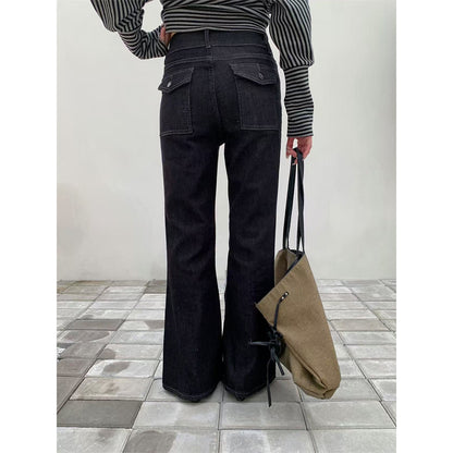 Woman wearing Retro Double Buckle Flared Jeans in a urban street setting