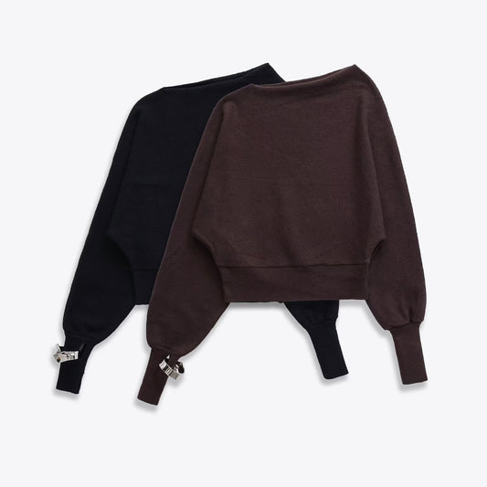 Woman wearing Asymmetric Bracelet Knit Sweater in a modern setting