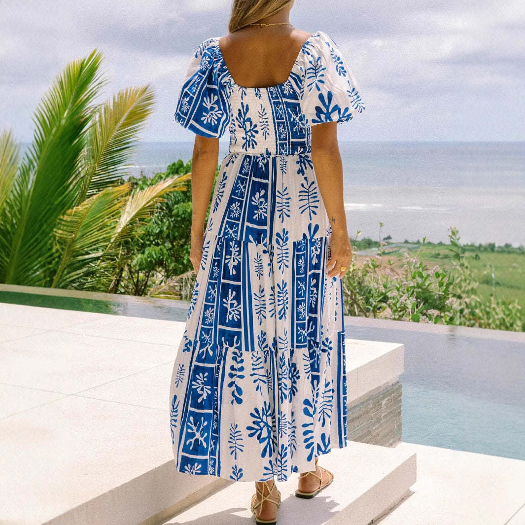 Woman wearing One-Shoulder Puff Sleeve Flared Maxi Dress in a garden setting