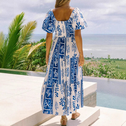 Woman wearing One-Shoulder Puff Sleeve Flared Maxi Dress in a garden setting