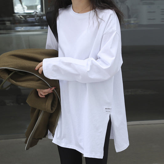 Woman wearing Solid Color Side Slit Long Sleeve T-Shirt in a casual setting